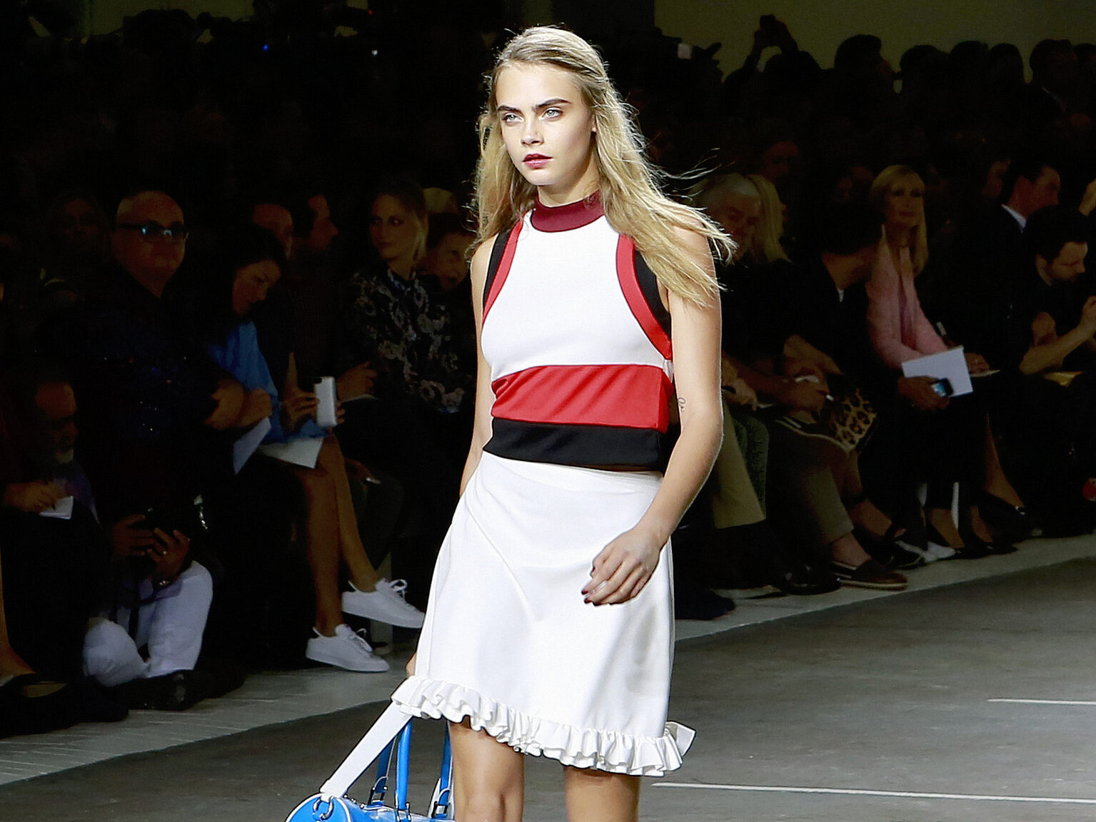 Cara Delevingne on the catwalk at London Fashion Week in 2014, the year after she recorded DJ Cara for GTA 5